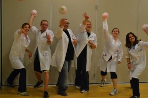 The champion team shows off their winnings: golden dodgeballs that have rhinos printed on them!
